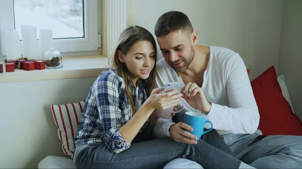 A couple checking something in social media