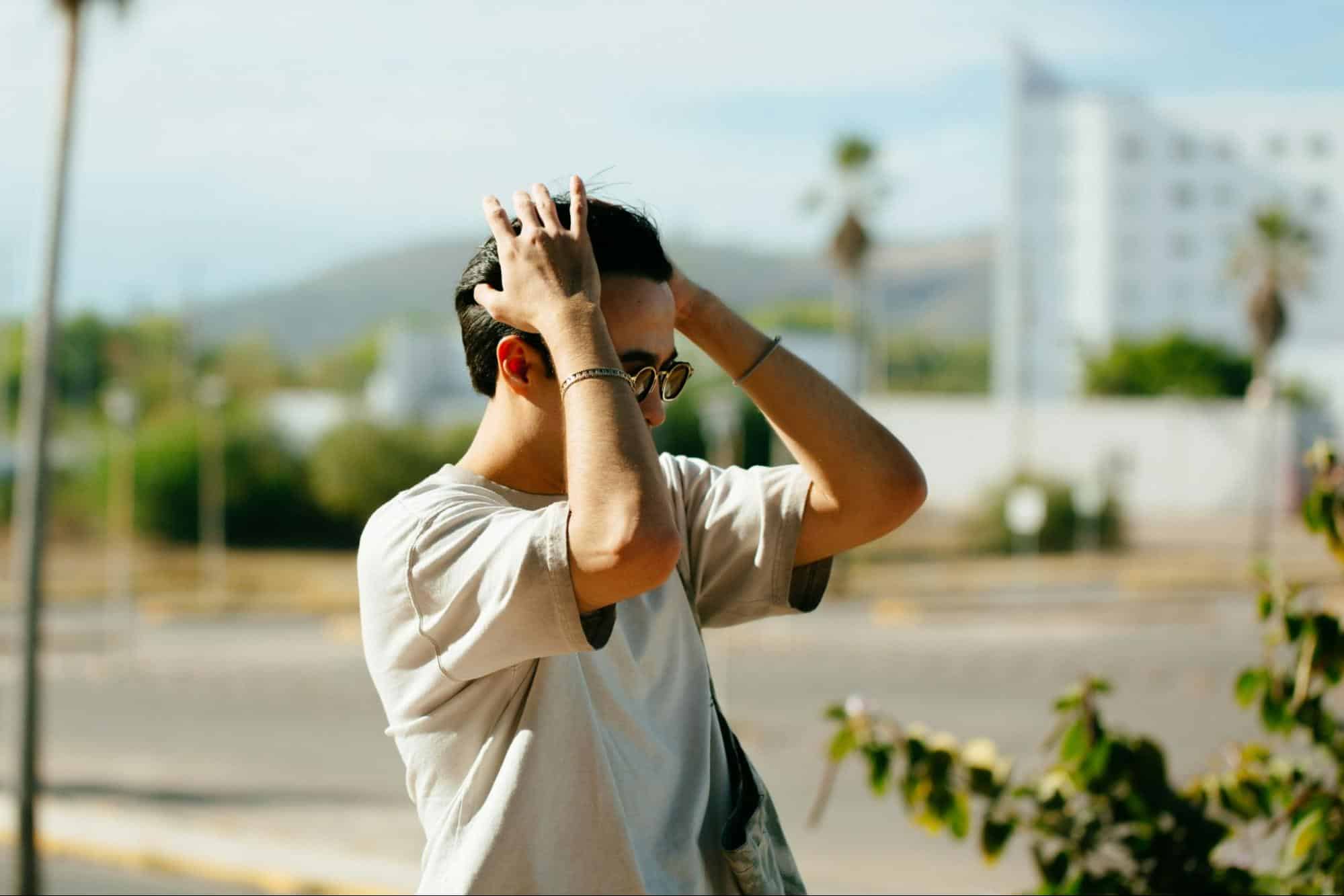 A man holding his head