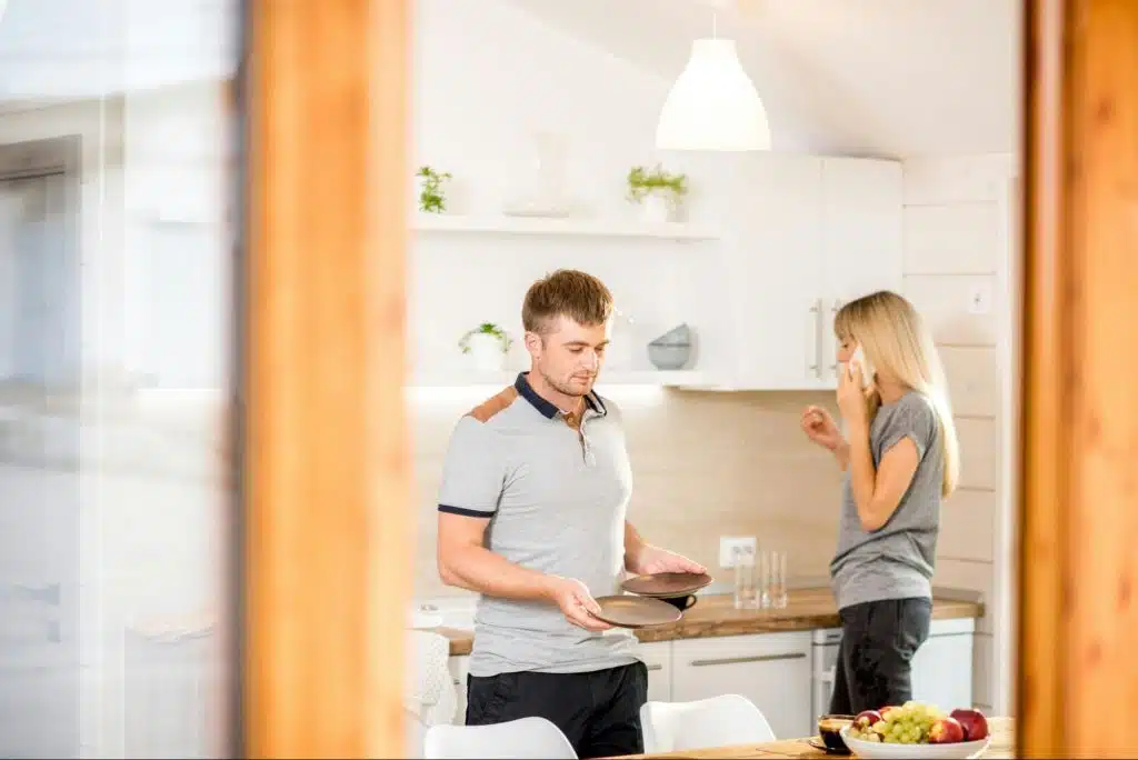 A man and woman at the kitchen