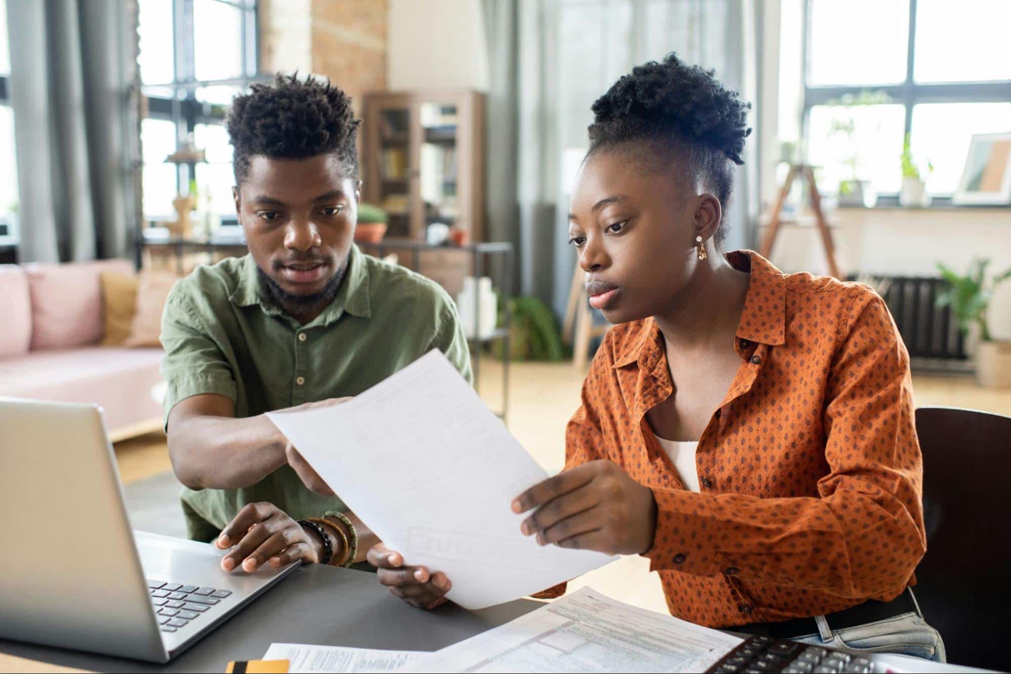 A woman letting a man to review her expenses