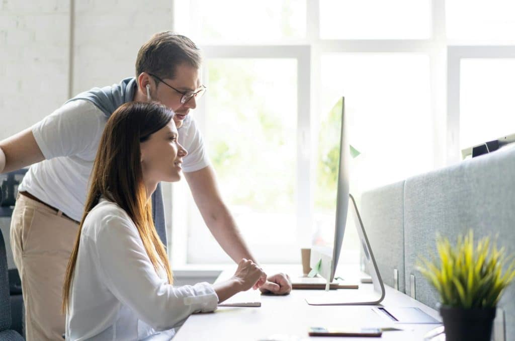 A man teaching a woman