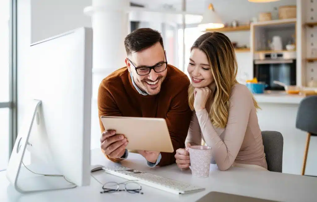 A man teaching something to woman 