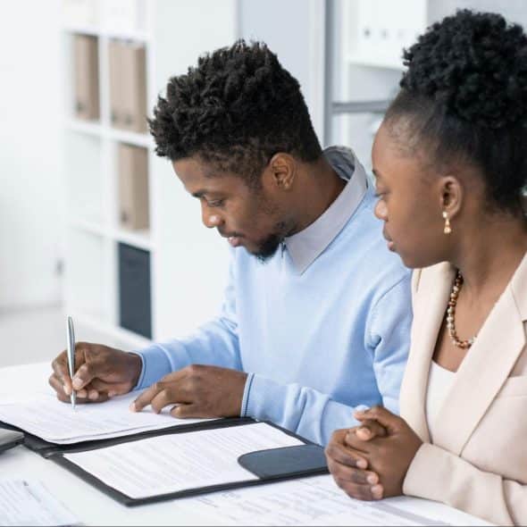 A man and woman checking their finances