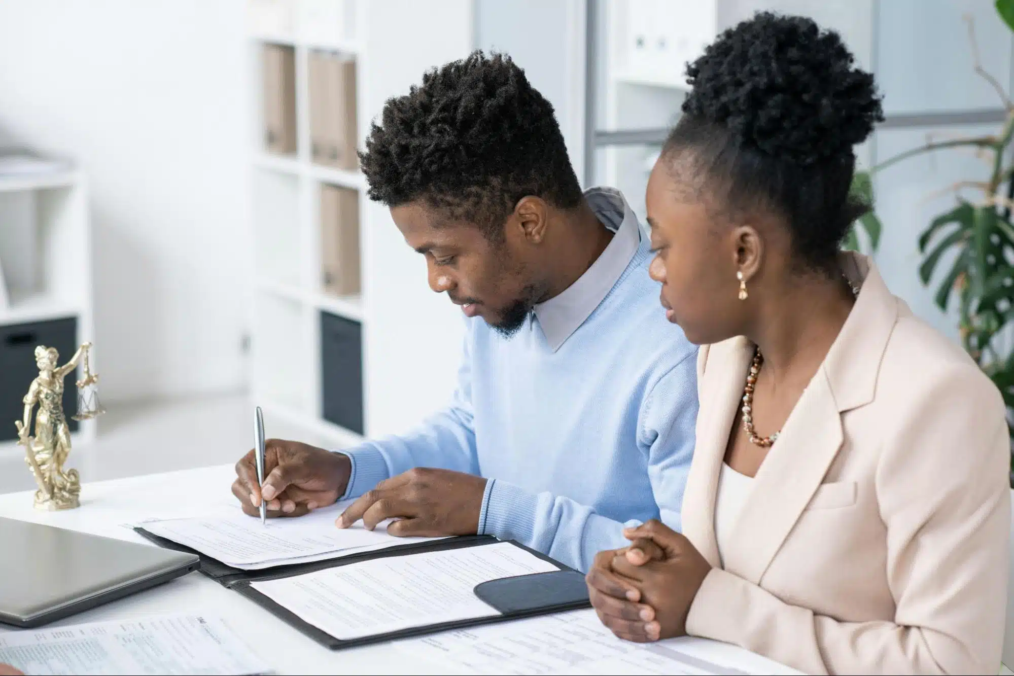 A man and woman checking their finances