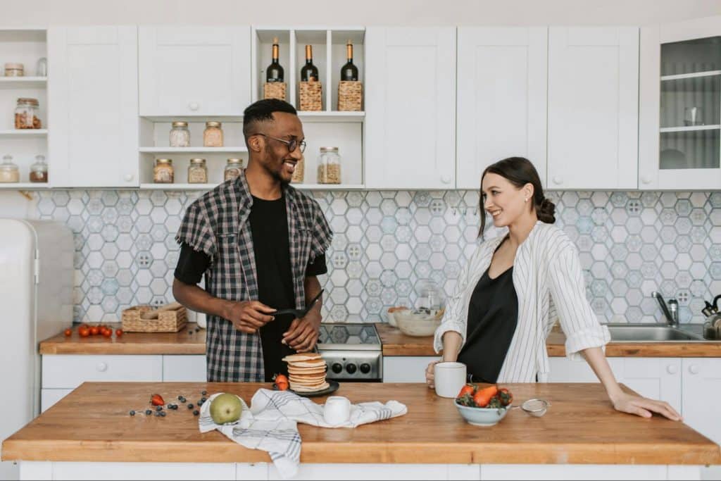 A man and woman at the kitchen
