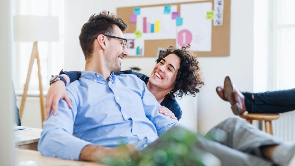 A man and woman smiling at each other