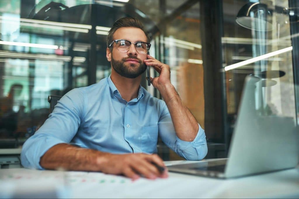 A man talking with someone over the phone