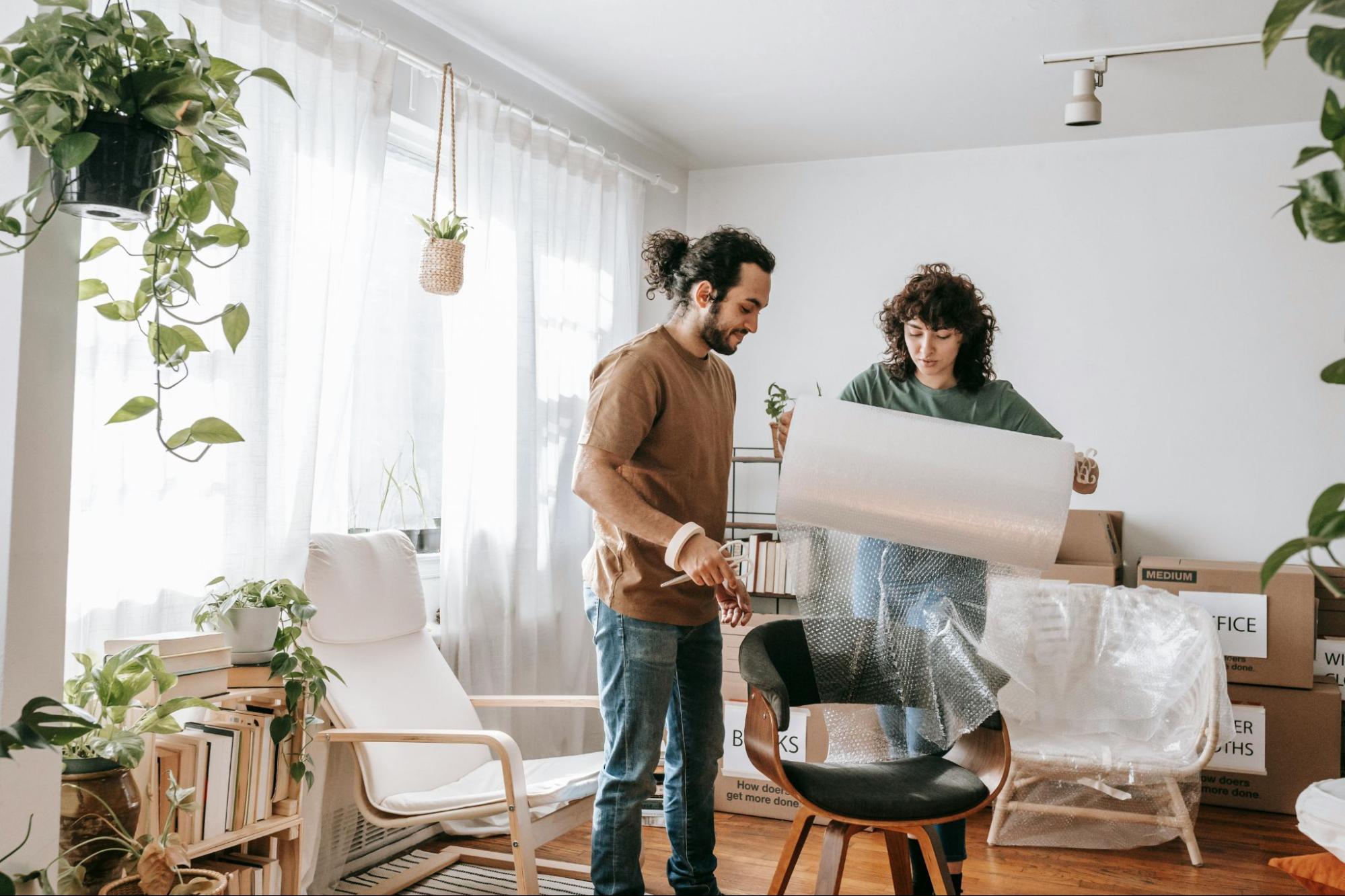A man helping woman to organize their things