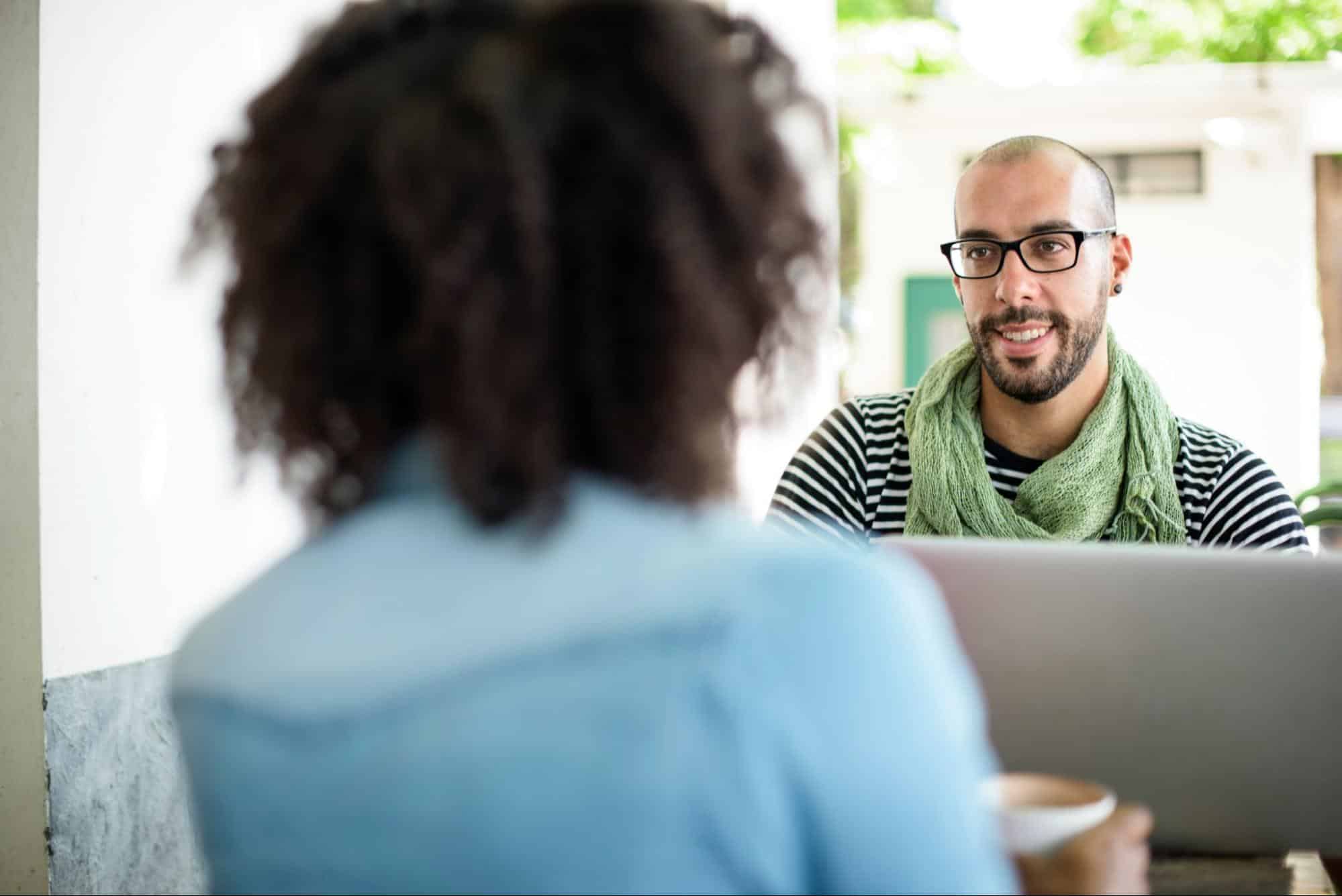 A man and woman talking