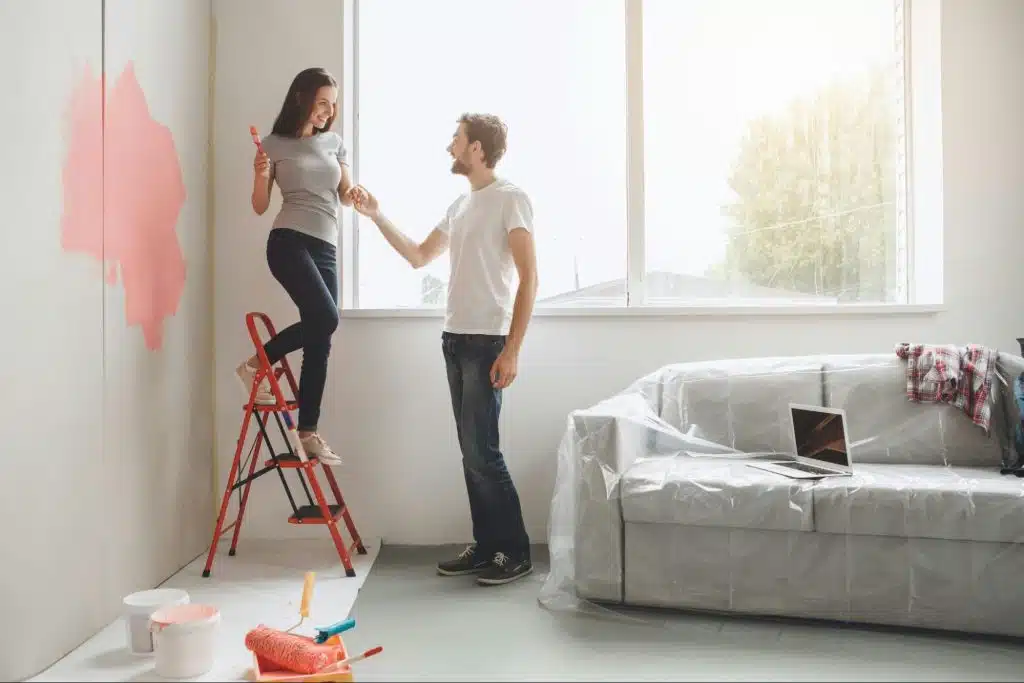A woman painting the wall