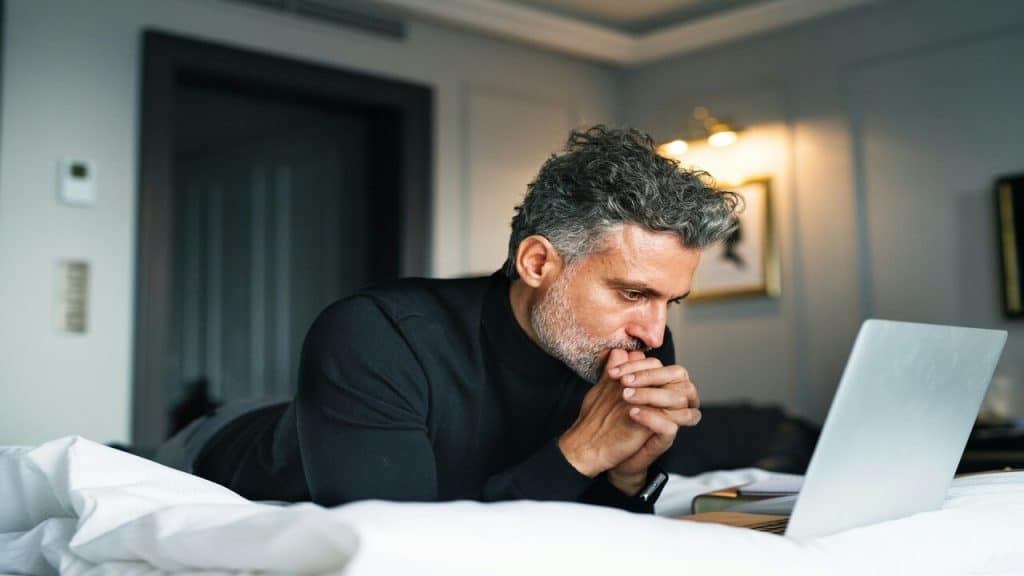 A mature man thinking deeply