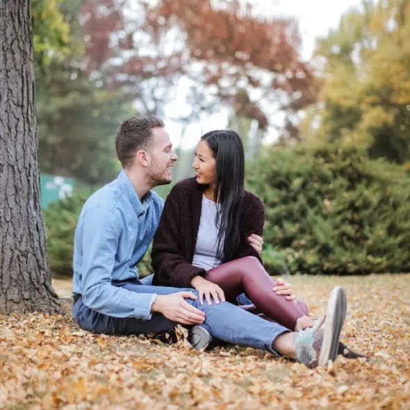 A couple sitting under the tree