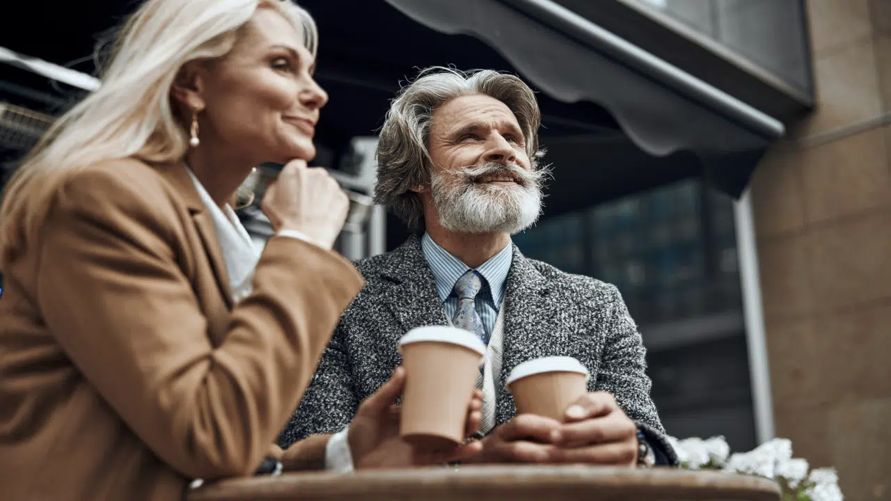 A couple talking over coffee
