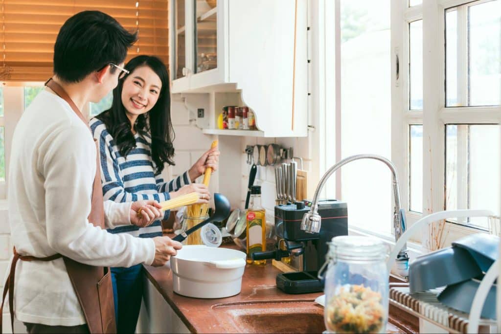 A man and woman at the kitchen