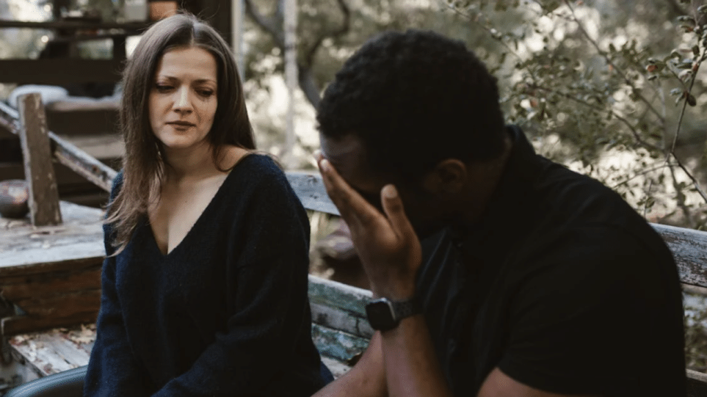 A couple crying while talking 