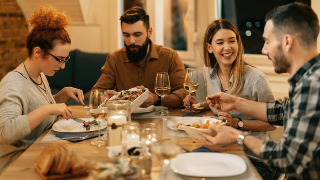 A group of people eating dinner together.