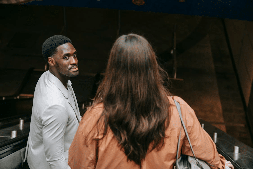 A man looking at a woman