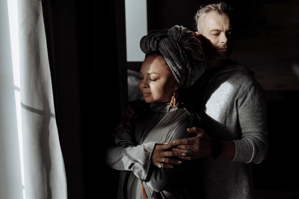 A man hugging a woman