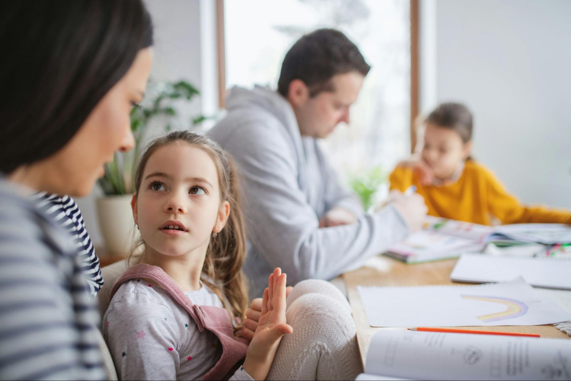 A woman teaching a child