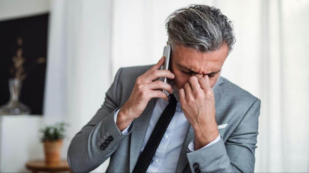 A man talking with someone over the phone