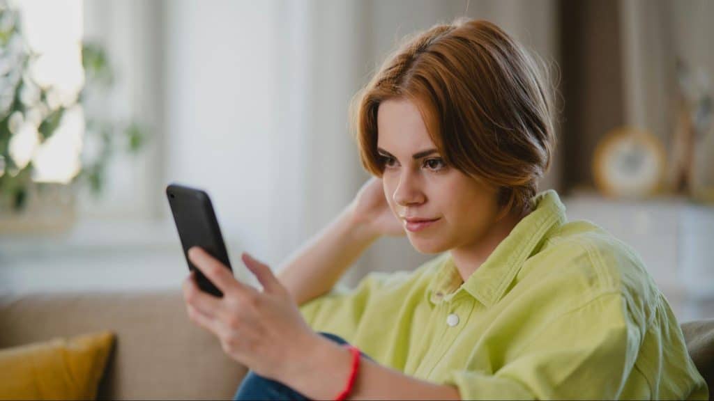A woman receiving a text message