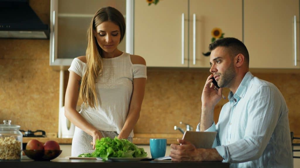 A couple busy in the kitchen