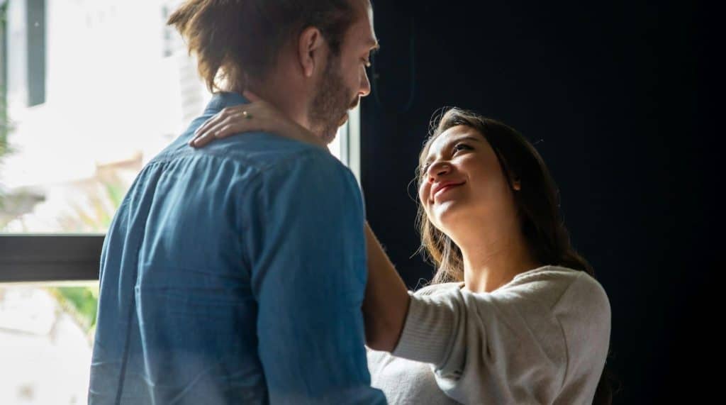 A woman looking up at her partner