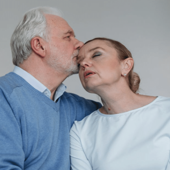 A man kissing his upset wife