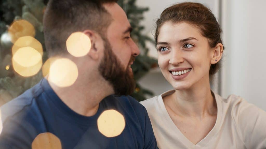 A woman looks lovingly at the man.