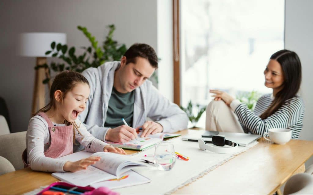 A man and woman having a bonding with their child