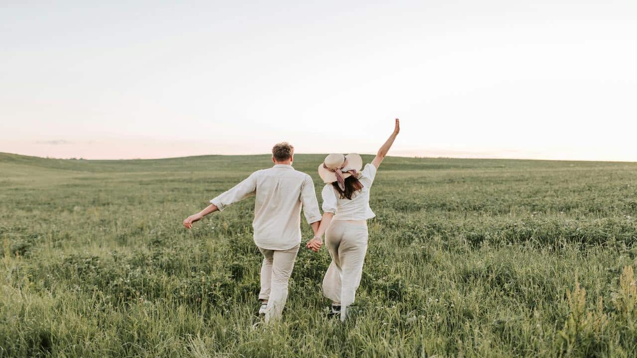 A couple walking on a field