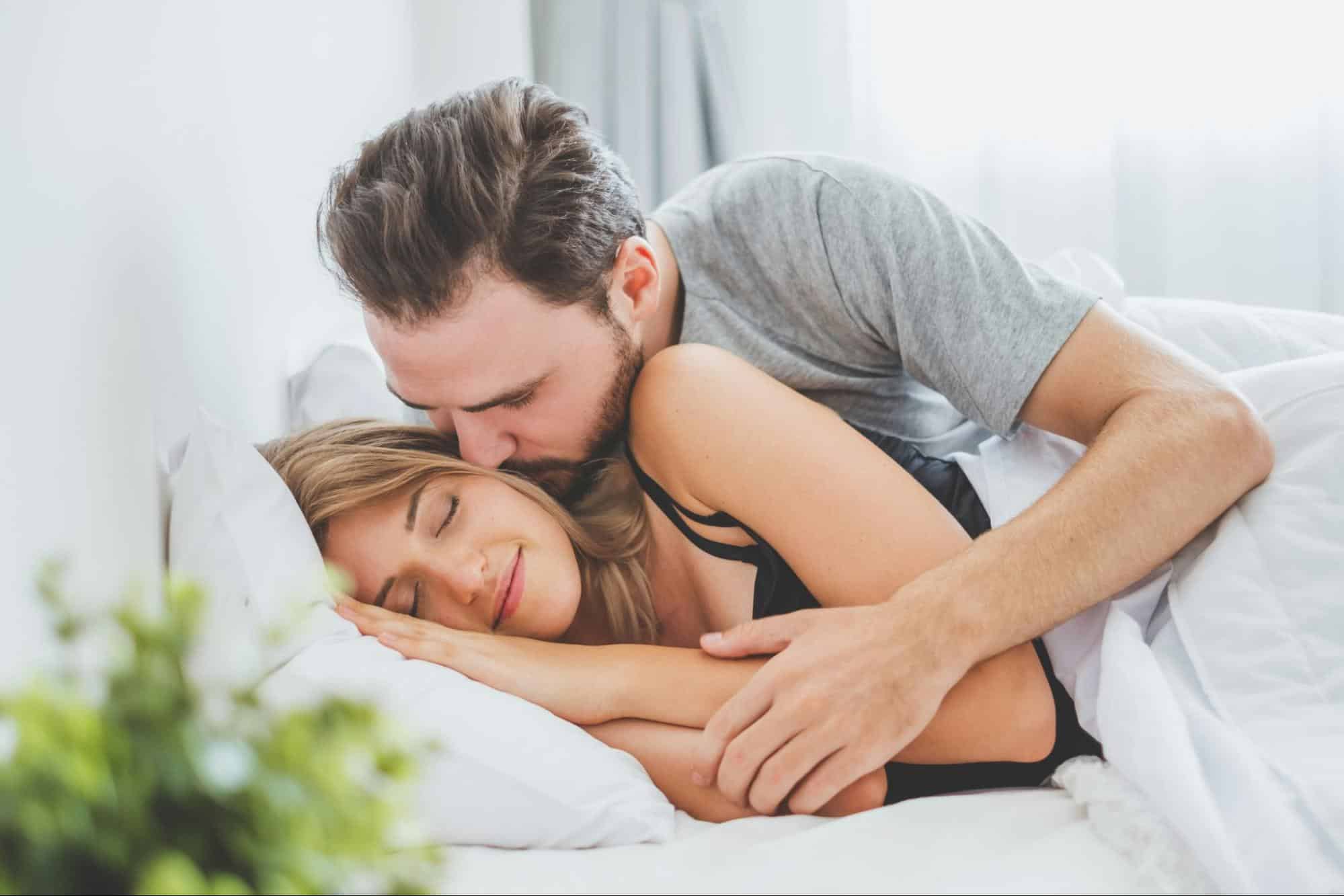 A man kissing woman’s cheek