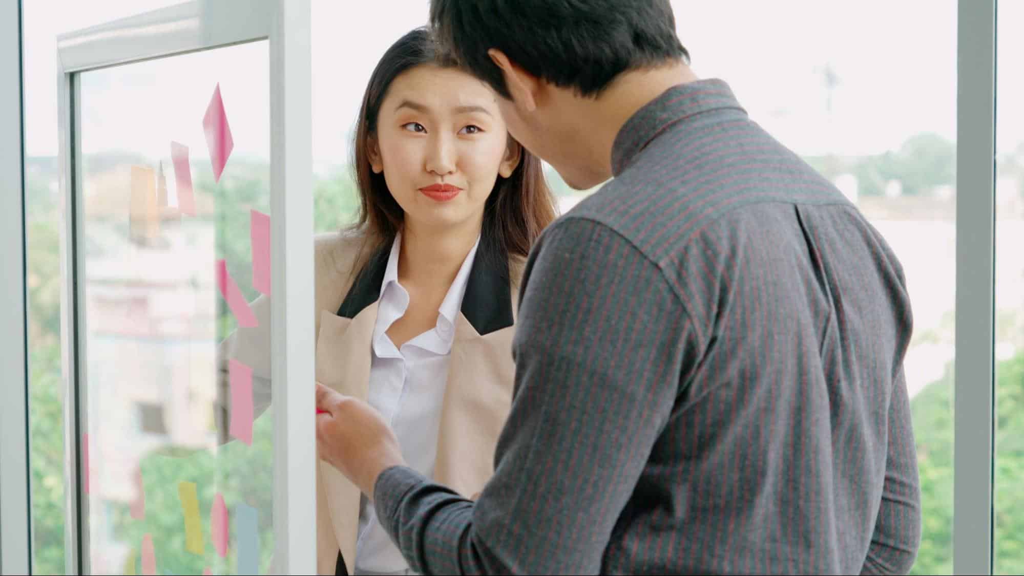 A man opening a door for a woman