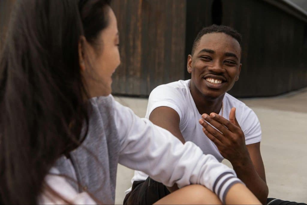 A man laughing at the woman