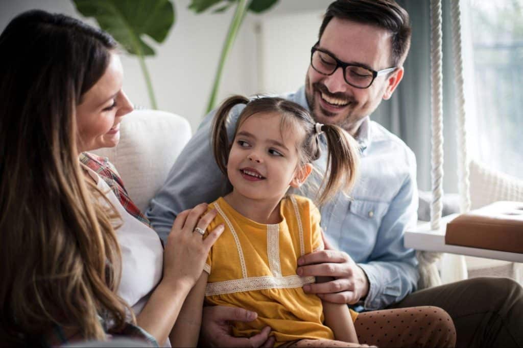 A man and woman having a bonding with their child