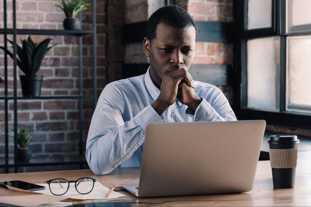 A man looking at the laptop