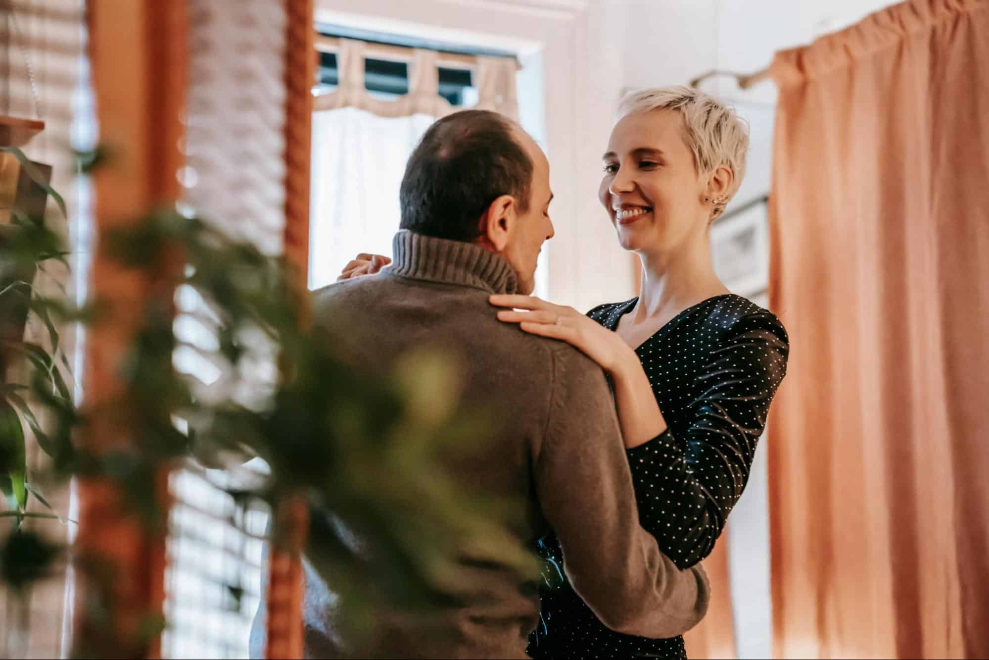 A man and woman facing each other