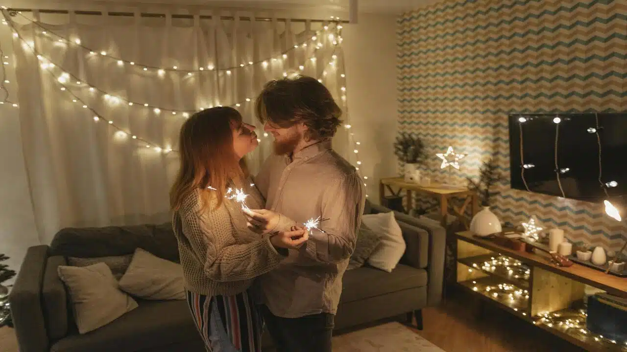 A couple slow dancing in the living room