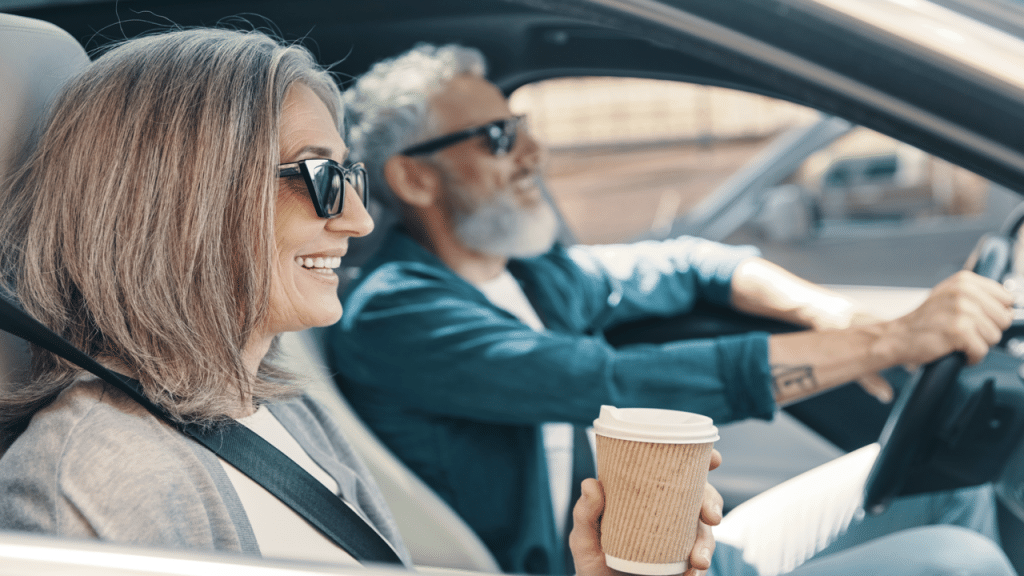 A couple driving to work together