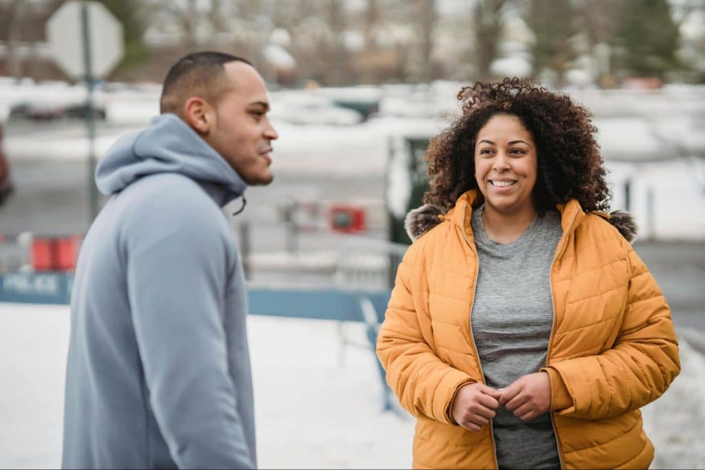A man talking to woman