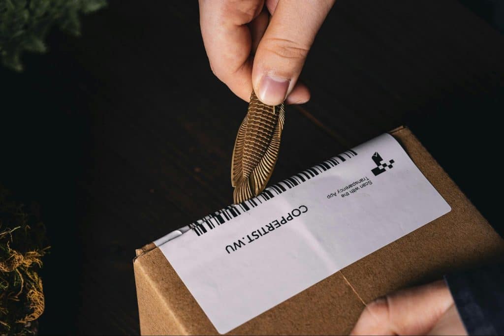 A person wrapping the gift