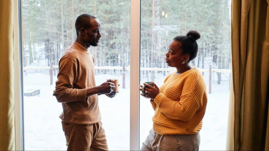A man and woman facing each other 