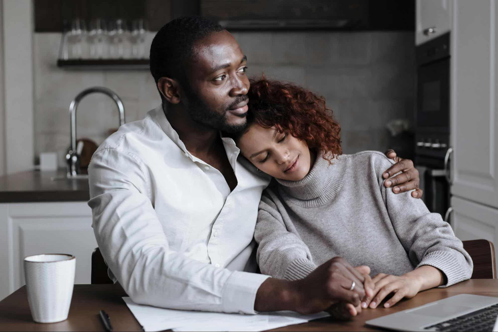 A man hugging a woman