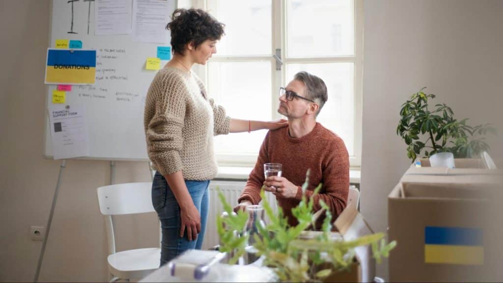 Woman assuring a man