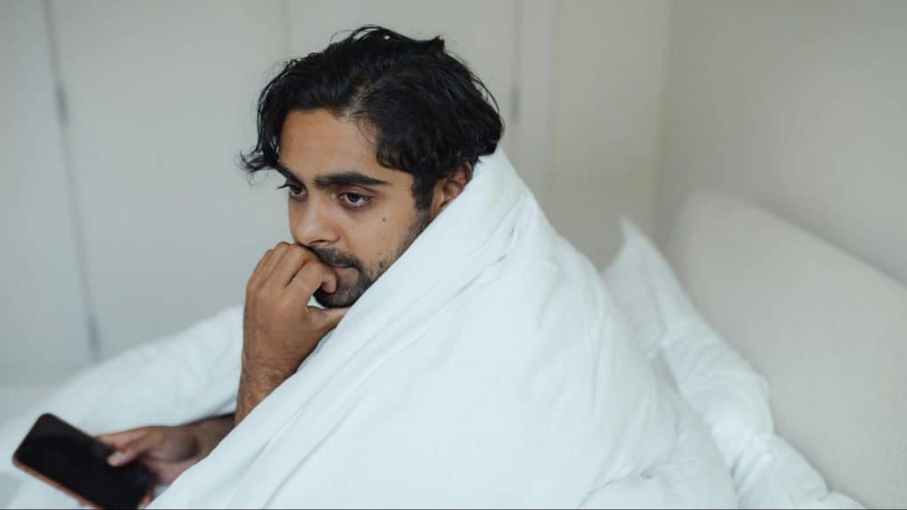 A man alone at the bed