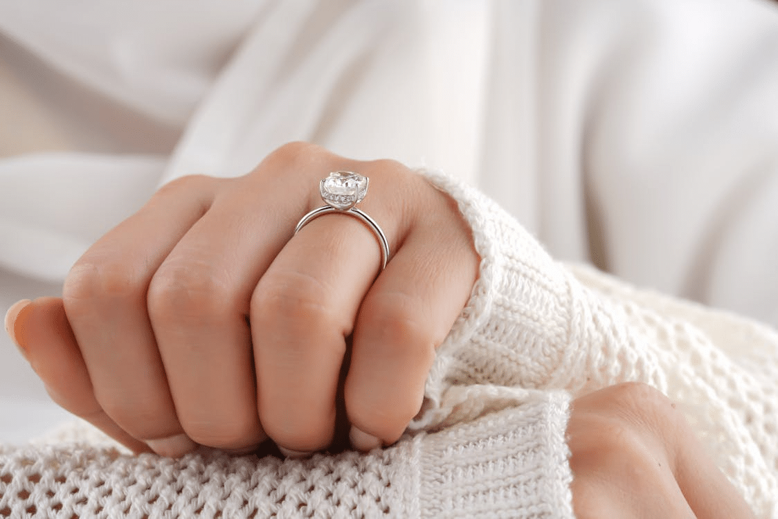 A woman wearing a diamond ring