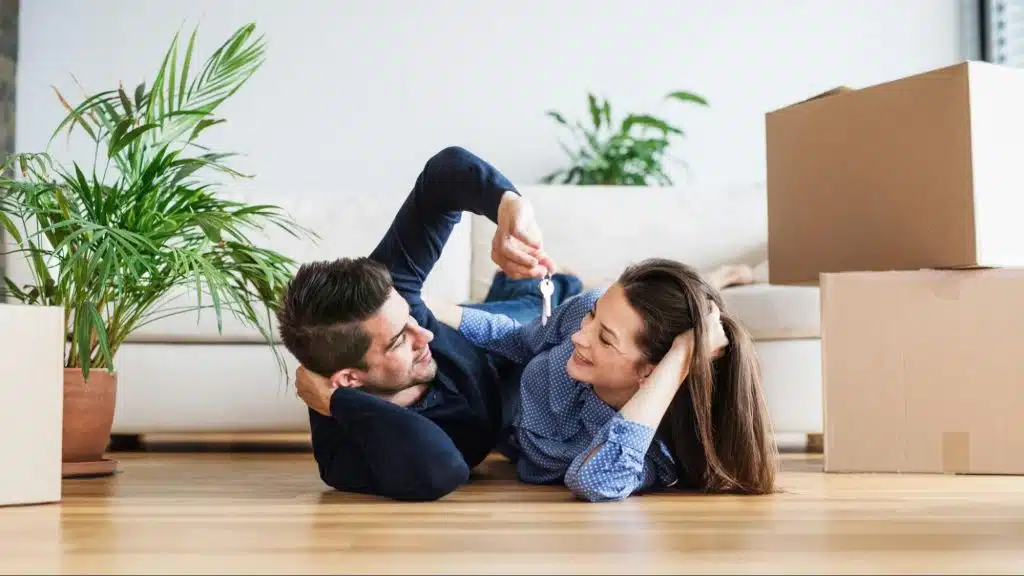 A man and woman laying on the floor