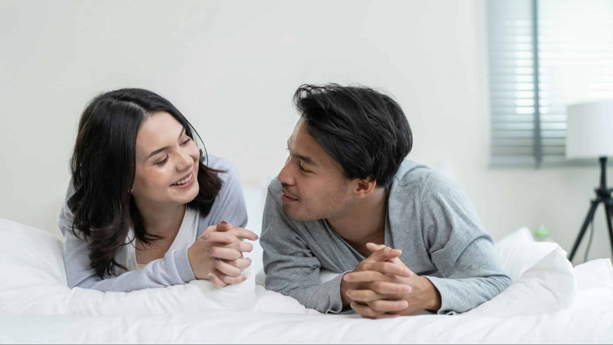 A man and woman smiling at each other