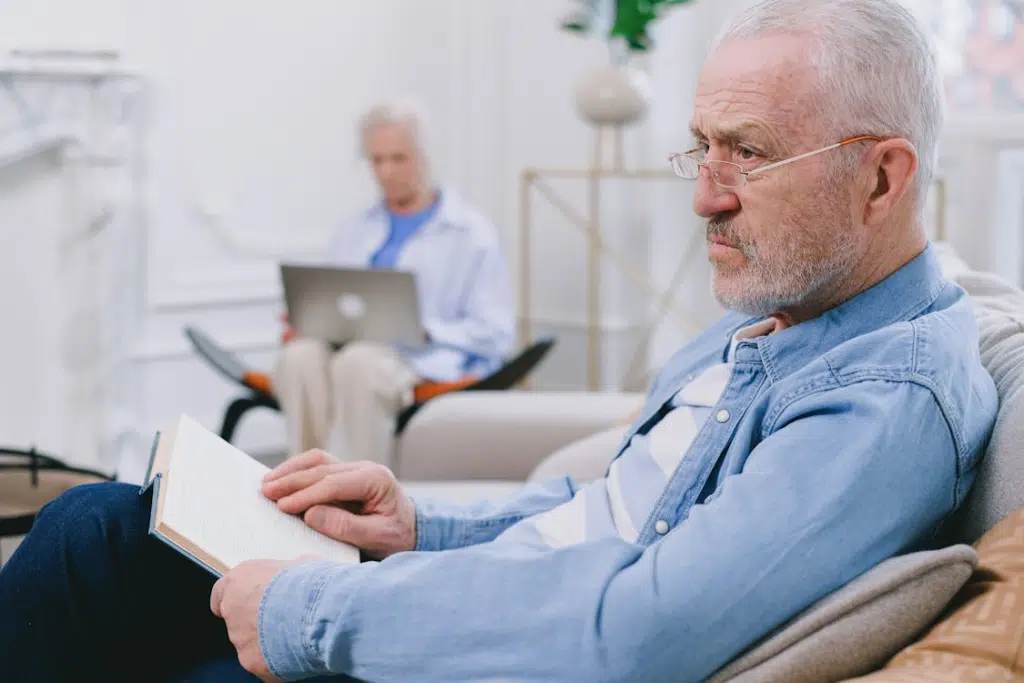 Senior couple sitting apart, ignoring each other