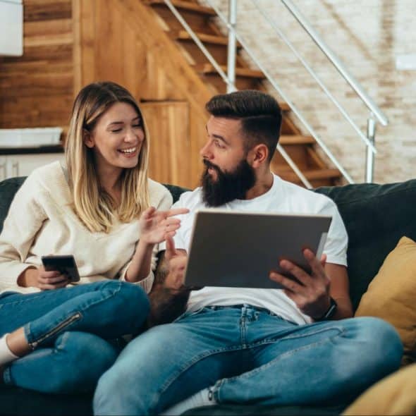 A couple sitting on the couch